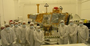 CERES instrument and team members  (foreground) and the NPP spacecraft, background Photo courtesy Ball Aerospace Corporation